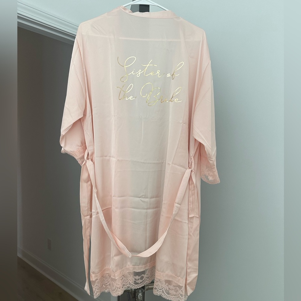 New. Sister of the bride rose colored robe with gold foil print. One size.